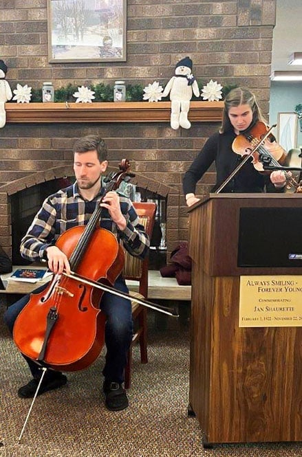 two musicians playing violin