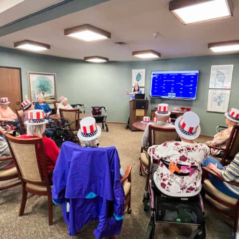 group of elders playing president jeopardy in the common area
