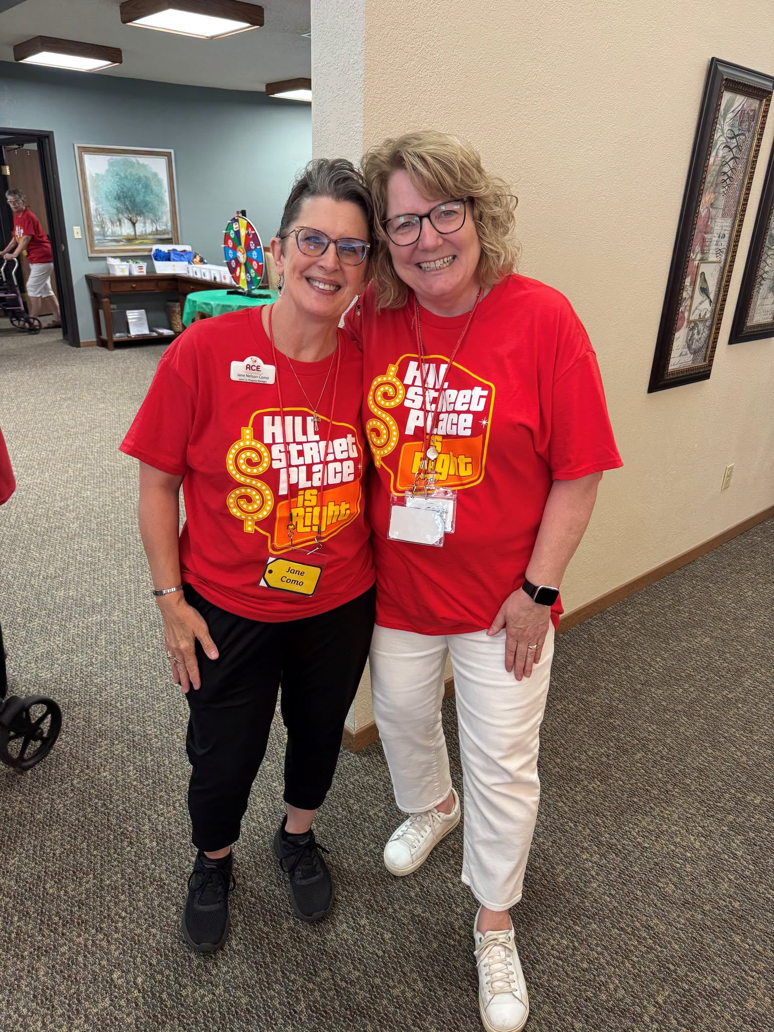 Two women in Hill Street price is right t-shirts
