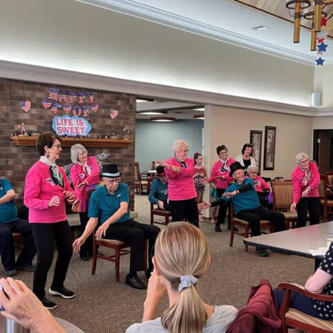elders doing a dance show in the common area