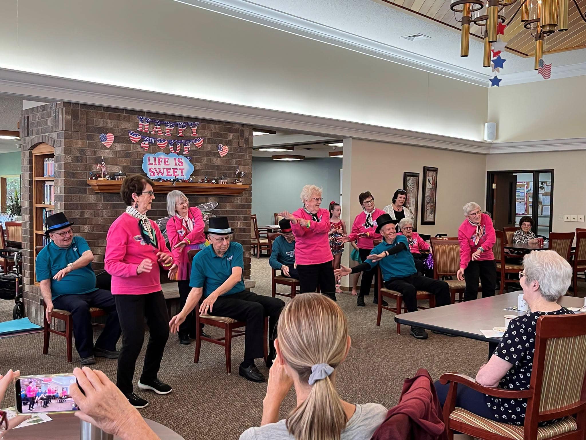 elders doing a dance show in the common area