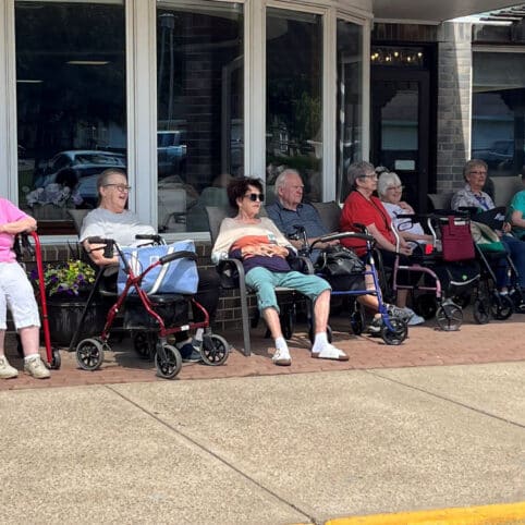 tenants at hill street place sitting outside