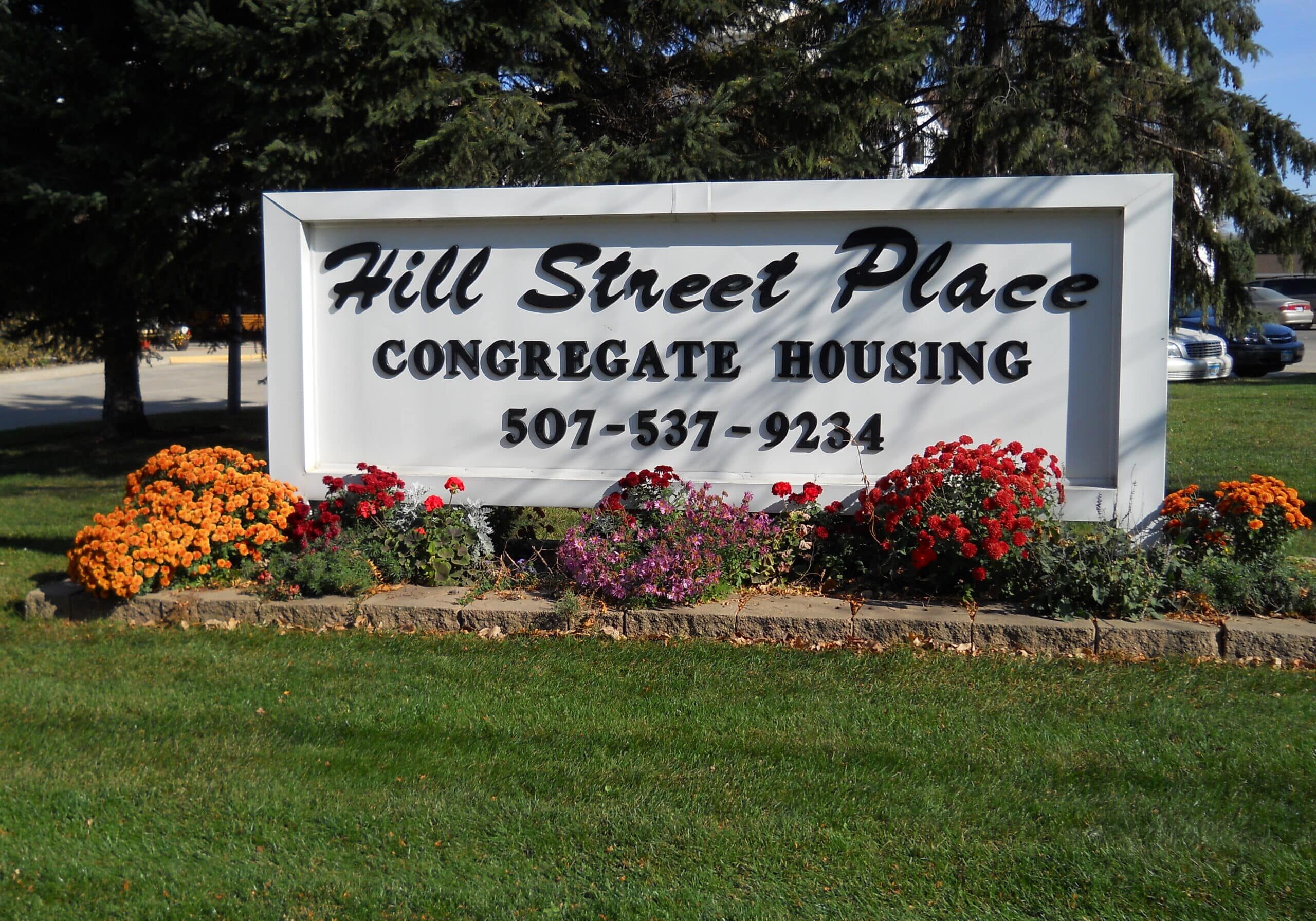hill street place front sign with beautiful garden bedding