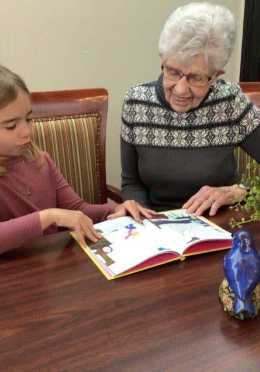 2nd grade readers reading to tenant at Hill Street Place